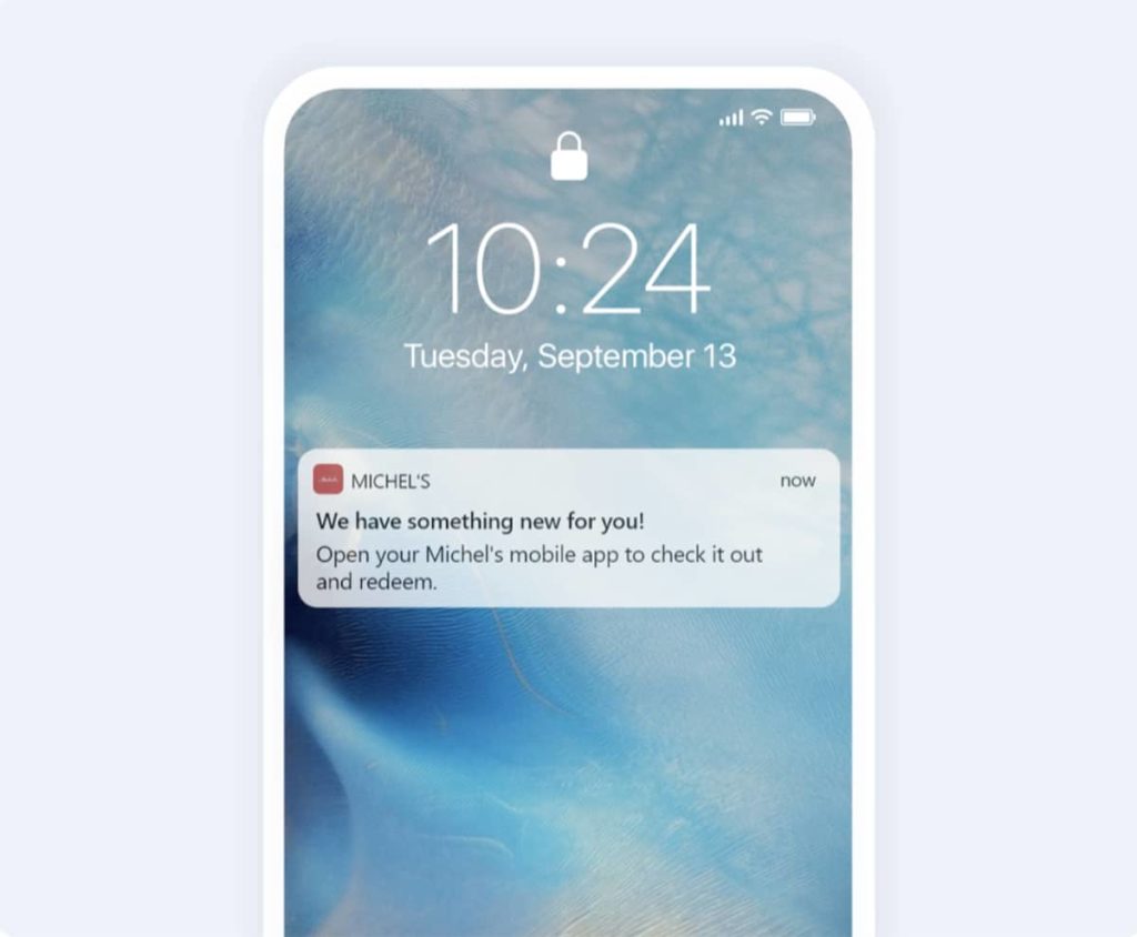 An iPhone with an offer message displayed on the screen.