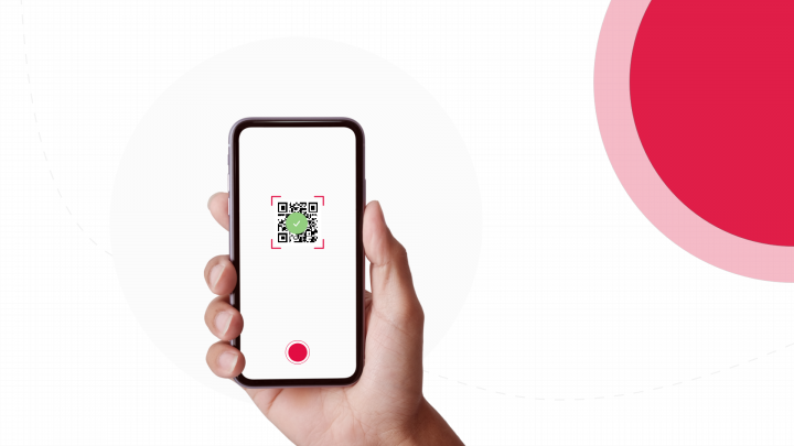 A person holding a phone with a QR code on it representing QR code ordering for table service at a restaurant.
